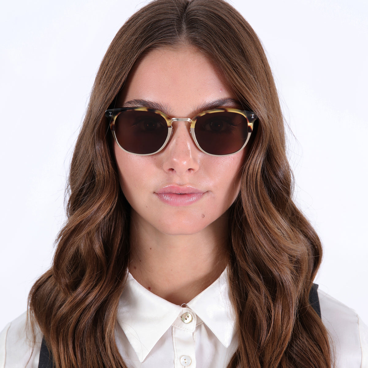 Woman wearing Stockholm Sunglasses in Tortoise with Gold lenses