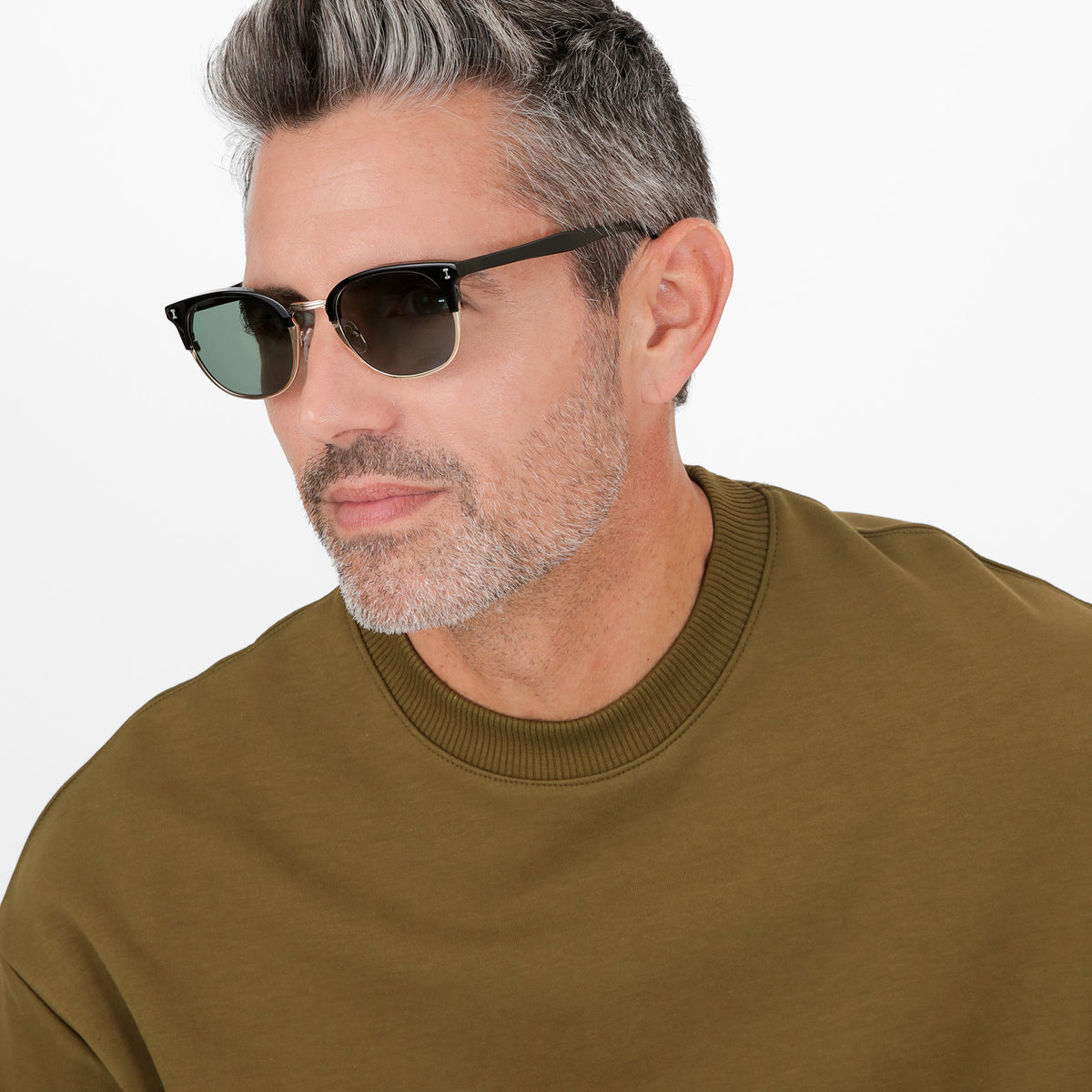 Man wearing Stockholm Sunglasses in Black with Gold lenses, Model with salt and pepper hair and beard