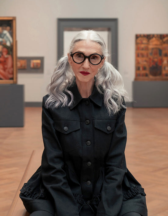 Model with silver hair wearing the Met x illesteva Optical in Black in front of paintings at the Met Museum