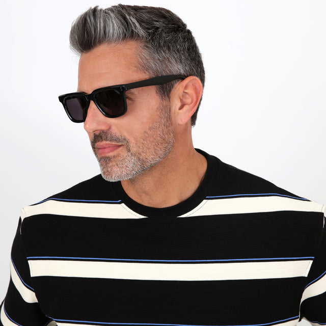Model with salt and pepper hair and beard wearing Toscana Sunglasses Black with Grey