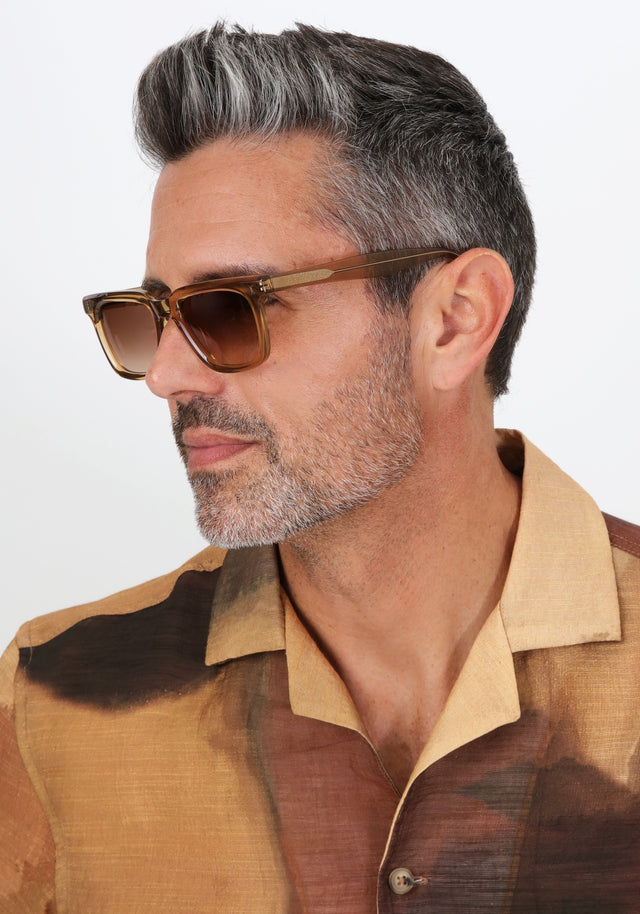 Model with salt and pepper hair and beard wearing Toscana Sunglasses in Brown