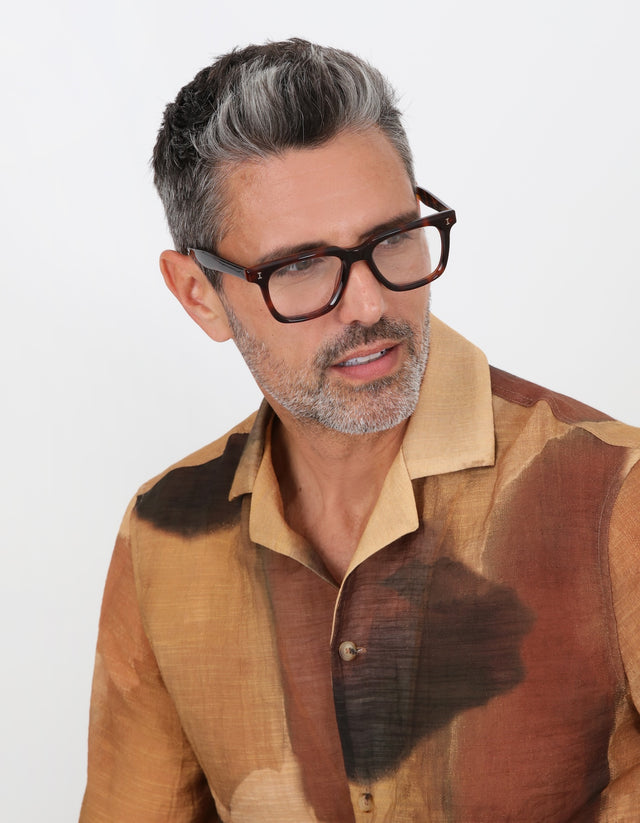 Man in Toscana Optical Havana wearing a brown linen shirt