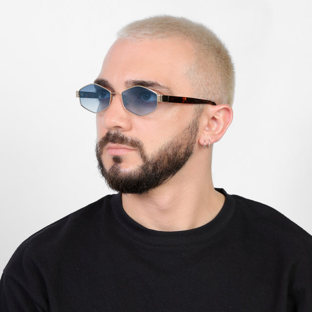 Bearded model looking right wearing Tucson Sunglasses Gold/Star Tortoise with Midnight Blue Gradient