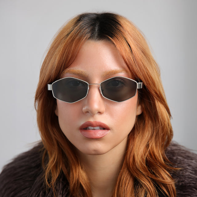 Model with red hair wearing Tucson Sunglasses Silver/Winter with Grey