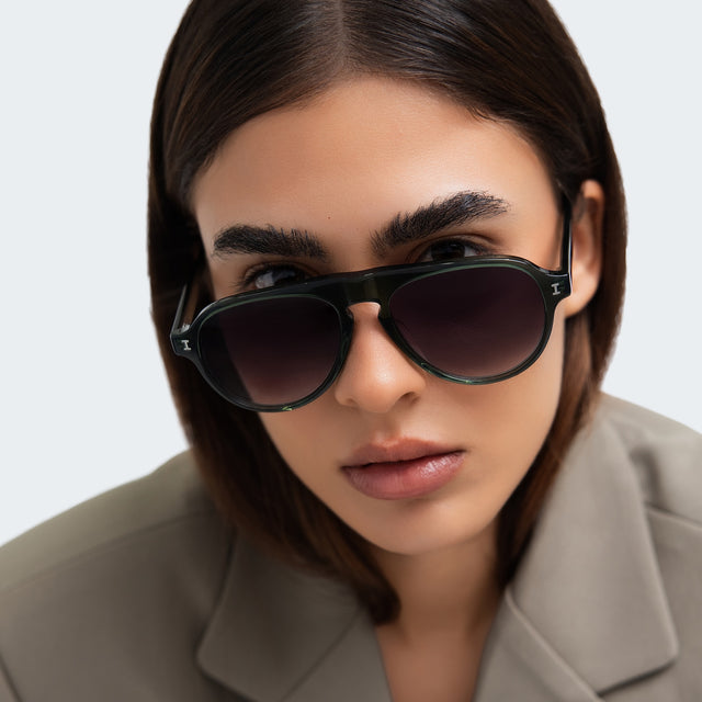 Close up of woman in a blazer Vanderbilt Sunglasses front view in Pine with Grey Gradient