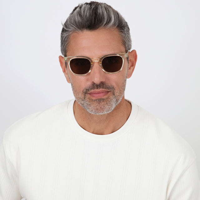Model with salt and pepper hair and beard wearing Veneto Sunglasses Champagne with Brown Flat