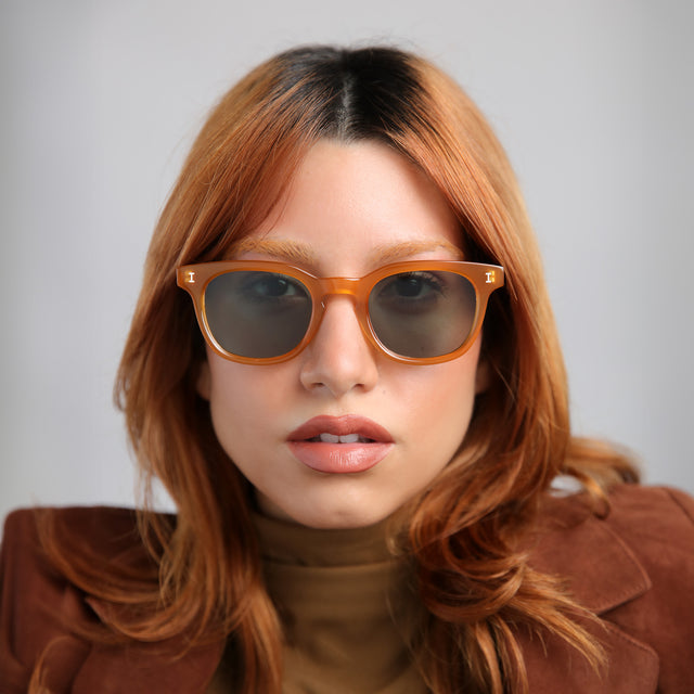 Model with red hair wearing Veneto Sunglasses Honey with Olive Flat