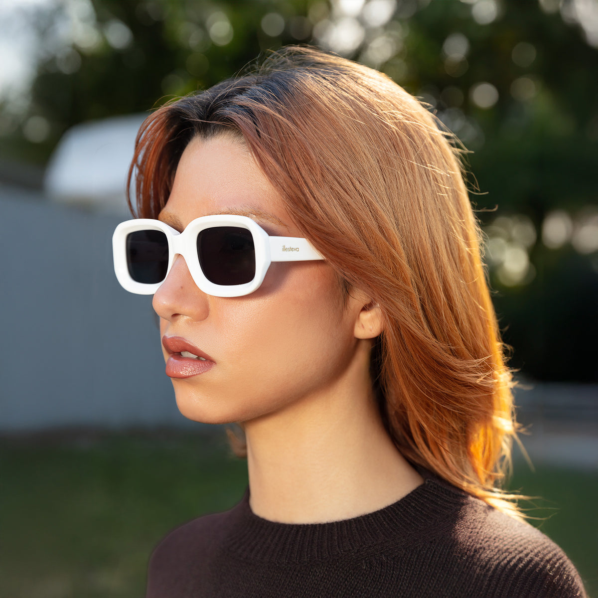 Woman wearing Vinyl Sunglasses in White with Grey lenses, Side profile of model