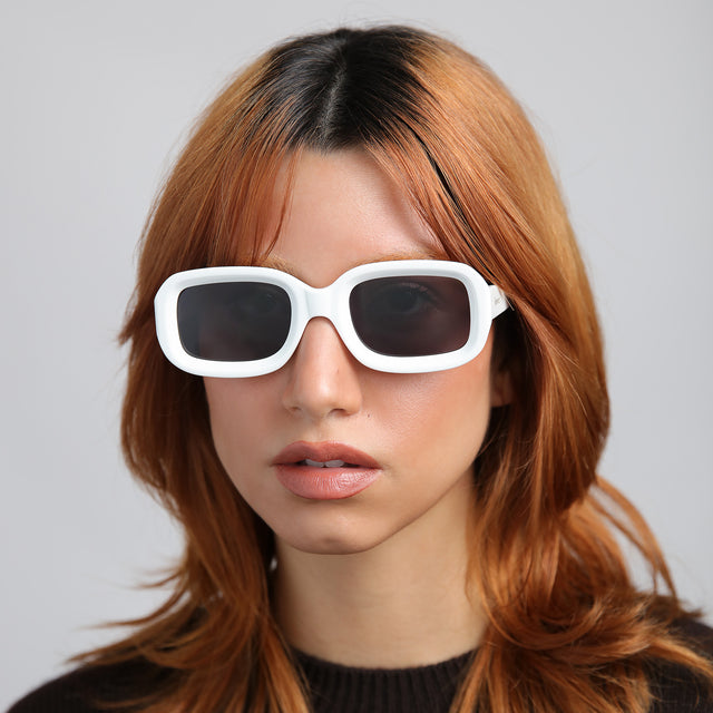 Close up of model with red hair wearing Vinyl Sunglasses White with Grey