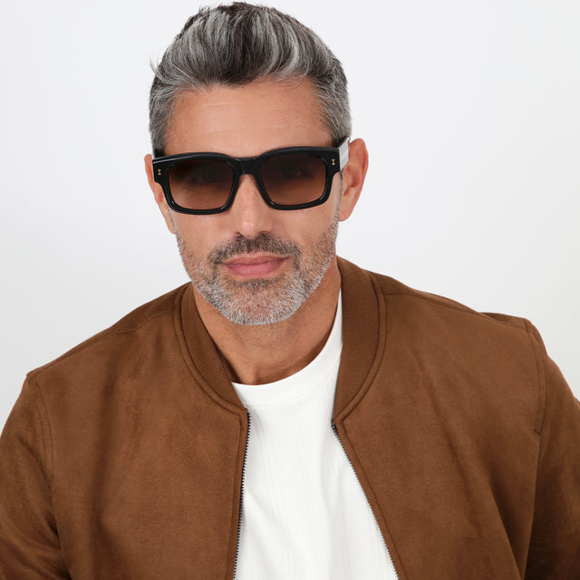 Model with salt and pepper hair and beard wearing Vito Sunglasses Black/Gold with Brown Gradient