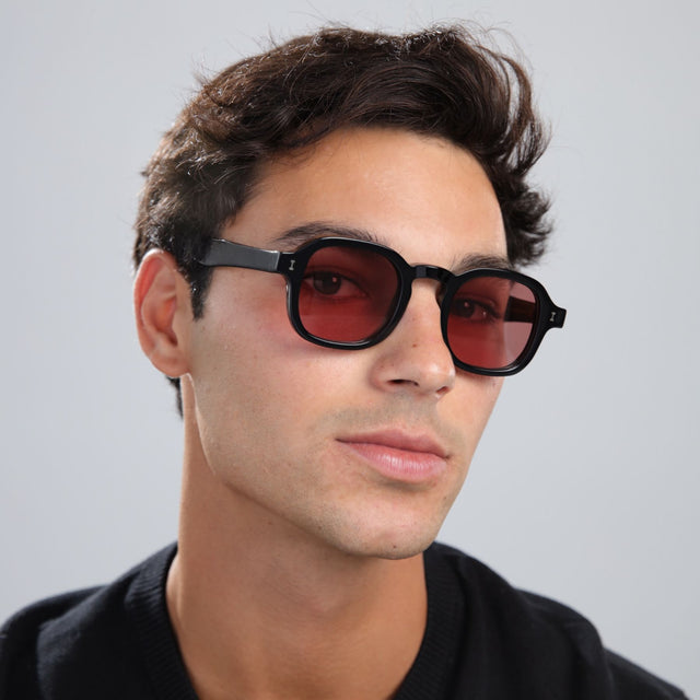 Another angle of man with brown hair in a black shirt wearing Washington Sunglasses Black with Bordeaux Flat See Through