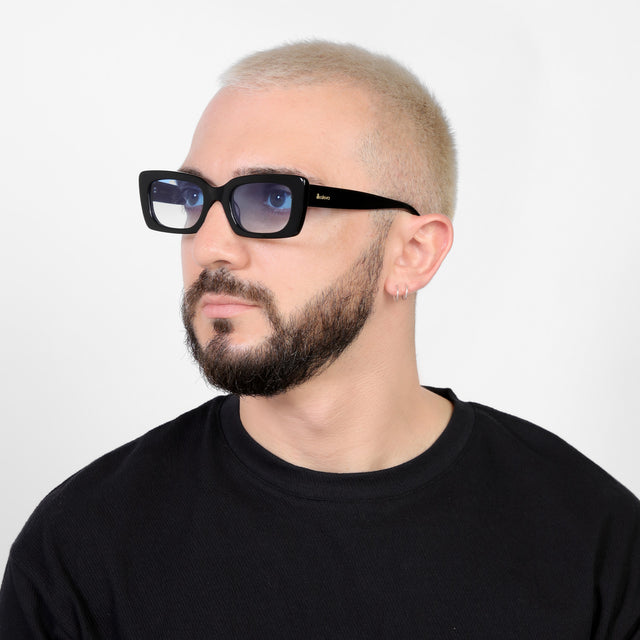 Bearded model looking right wearing Wilson Sunglasses Black with Blue Flat Gradient See Through