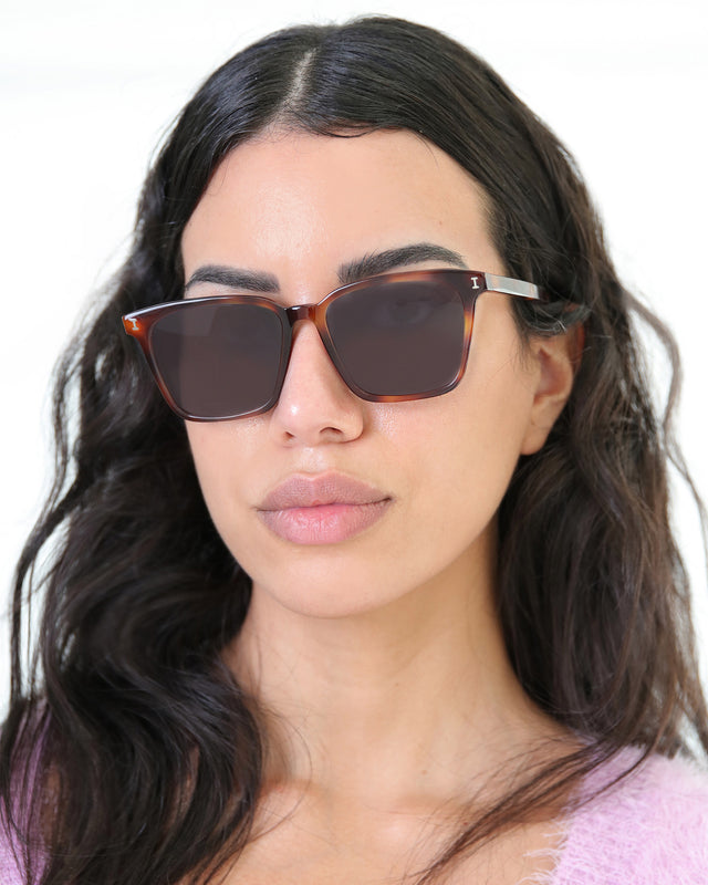 Brunette model with wavy hair wearing Asheville Sunglasses Havana with Grey