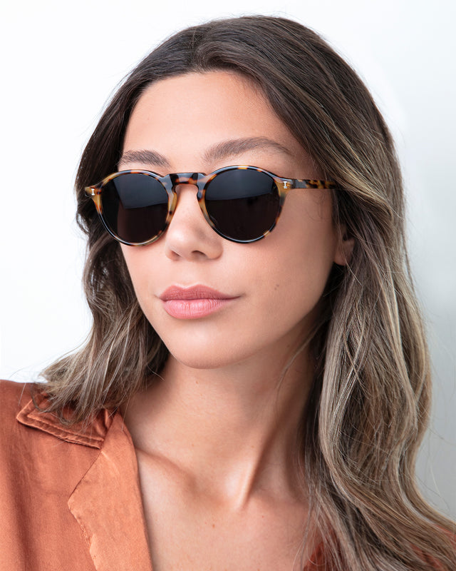 Brunette model with ombre wavy hair wearing Capri Sunglasses Tortoise with Grey
