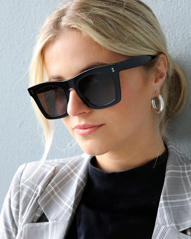 Blonde model in ponytail wearing Charleston Sunglasses Black with Grey Flat