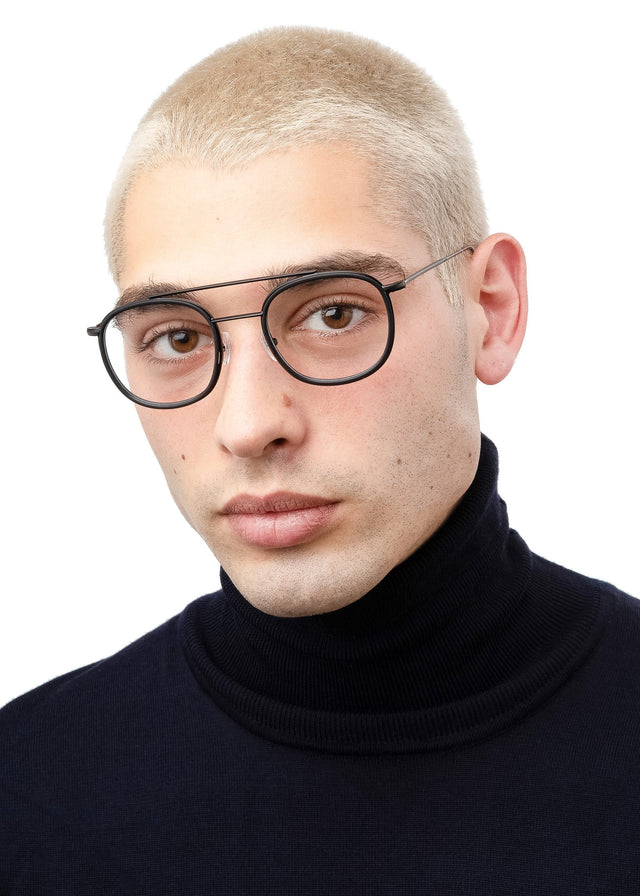 Blonde man with buzzcut wearing Corfu Optical Matte Black Optical