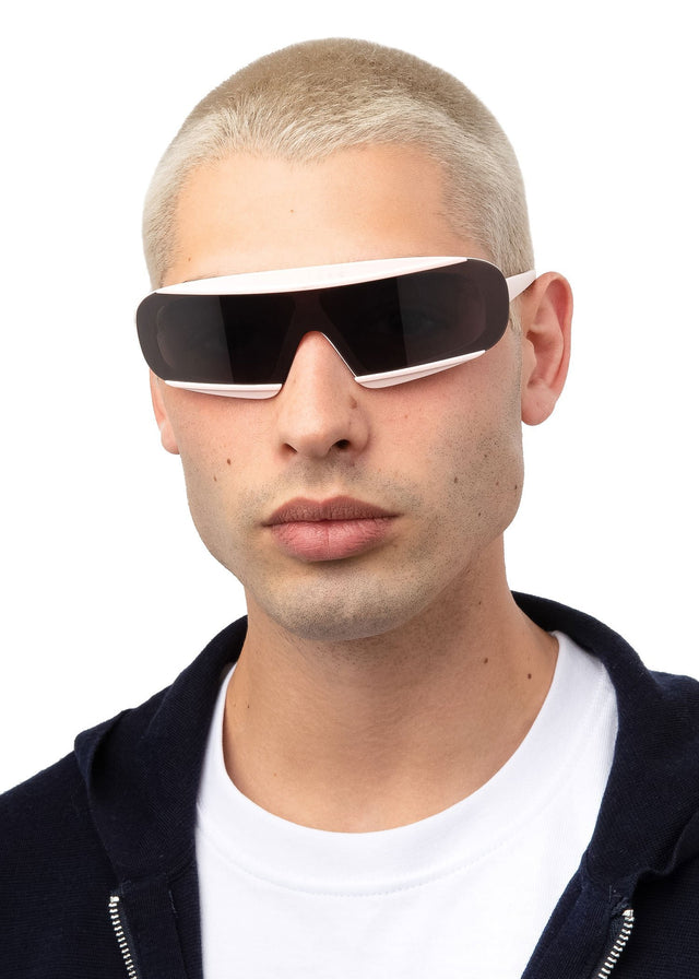 Blonde man with buzzcut wearing Courchevel Sunglasses Matte Blush with Grey