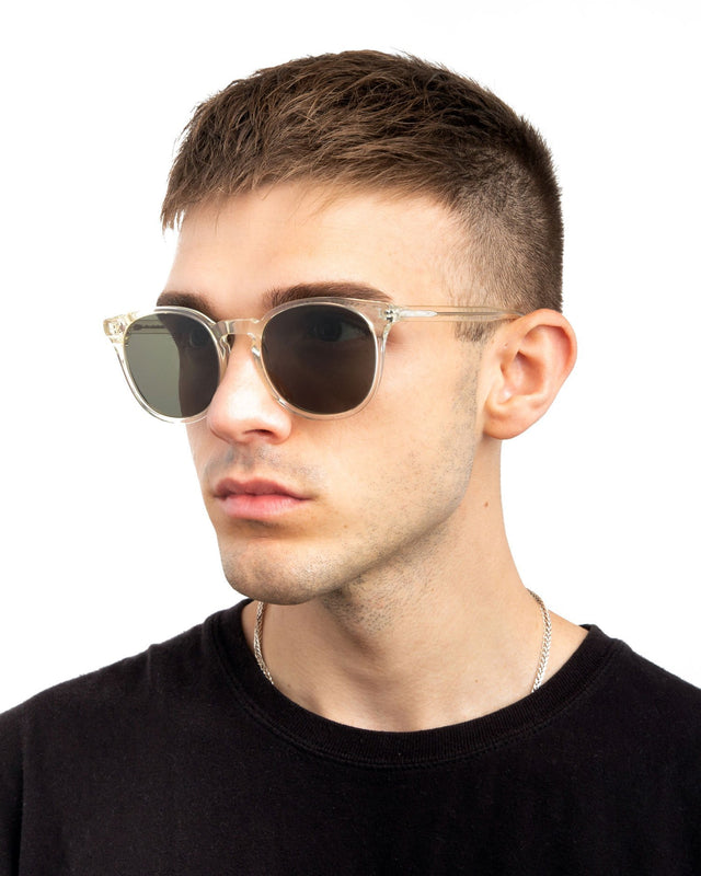 Model with short brown hair wearing Eldridge 56 Sunglasses Champagne with Olive Flat