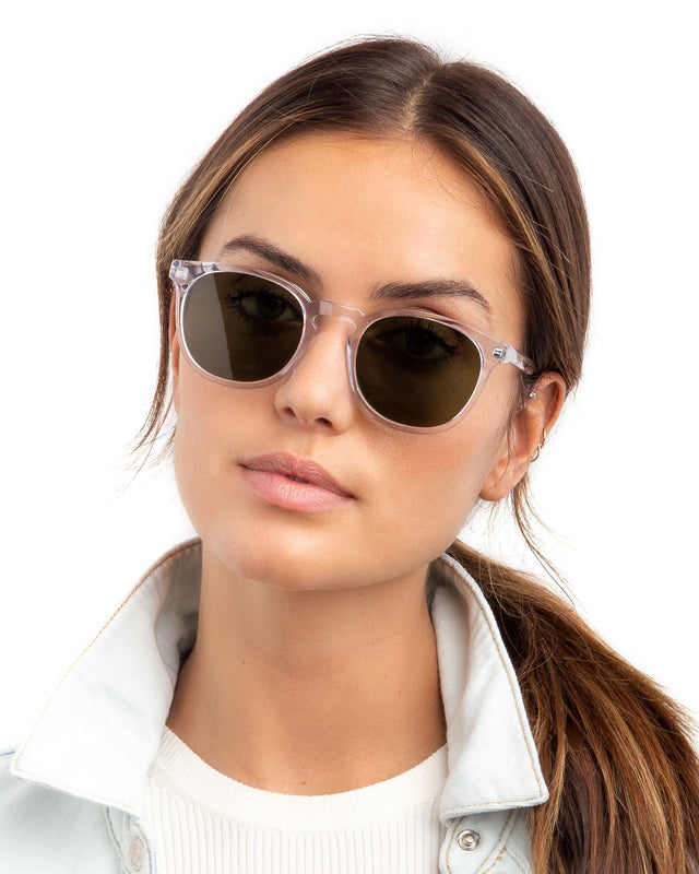 Brunette with a low ponytail wearing Eldridge Sunglasses Clear with Olive Flat