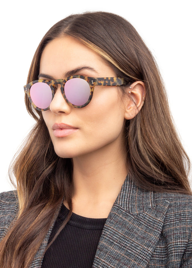 Brunette model with wavy hair wearing Leonard Sunglasses Tortoise with Rose Mirror