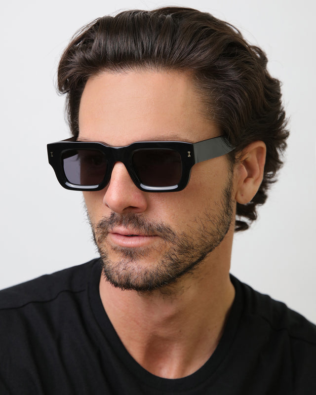 Model with brown hair combed back wearing Lewis Sunglasses Black with Grey Flat