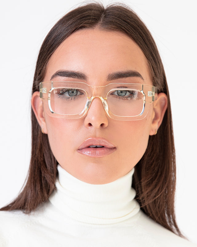 Brunette with straight hair wearing Lewis Optical Champagne Optical