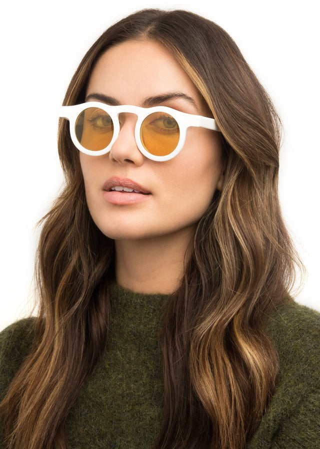wearing Marlene Sunglasses White with Honey See Through Lenses