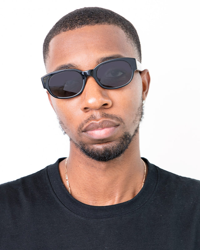 Bearded model with short brown hair wearing Montreal Sunglasses Black with Grey Flat