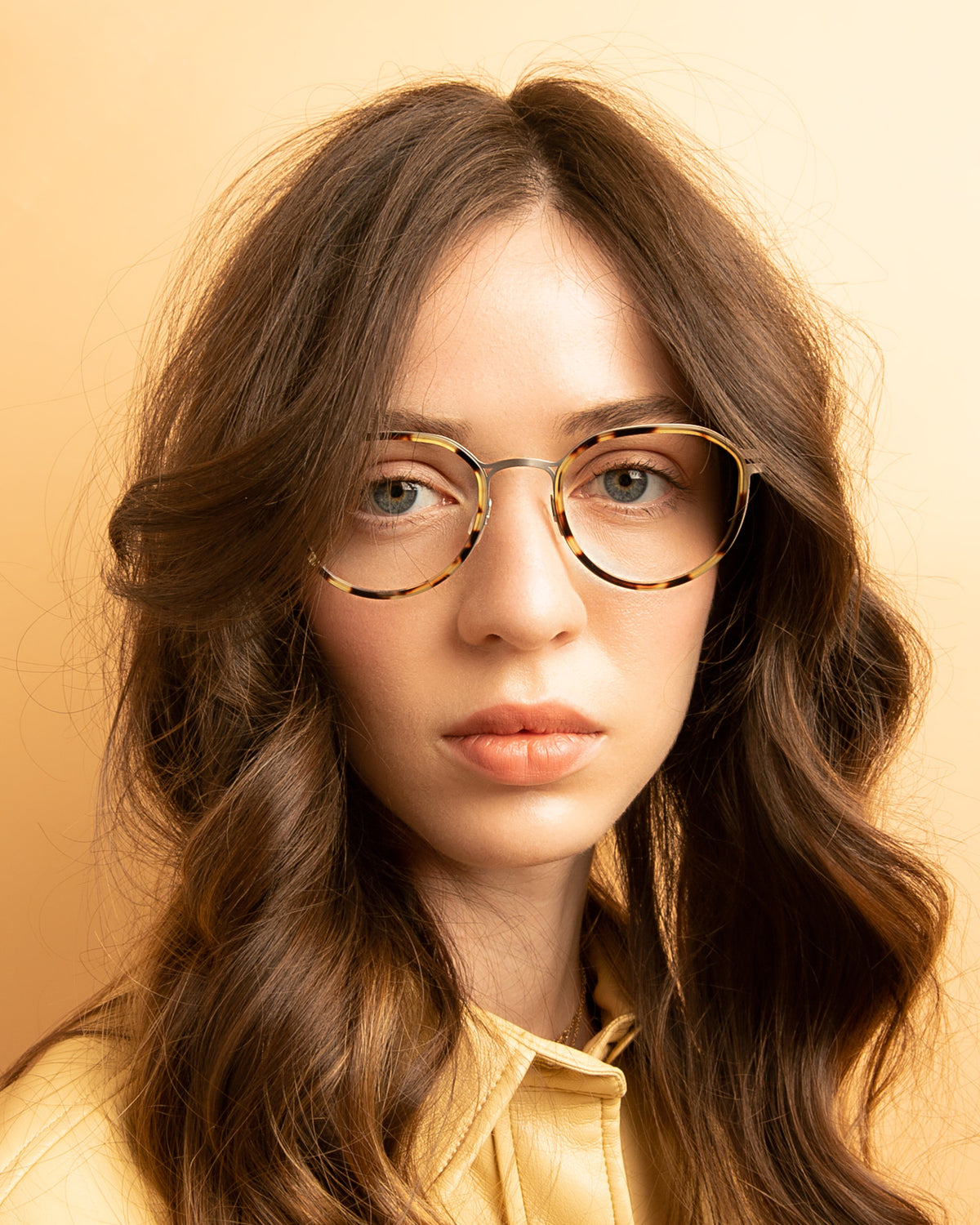 Woman wearing Tompkins Titanium Optical in Tortoise with Matte Silver Optical lenses, Brunette model with wavy hair