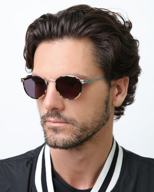 Model with semi short brown hair wearing Tompkins Titanium Sunglasses Tortoise/Matte Silver with Grey