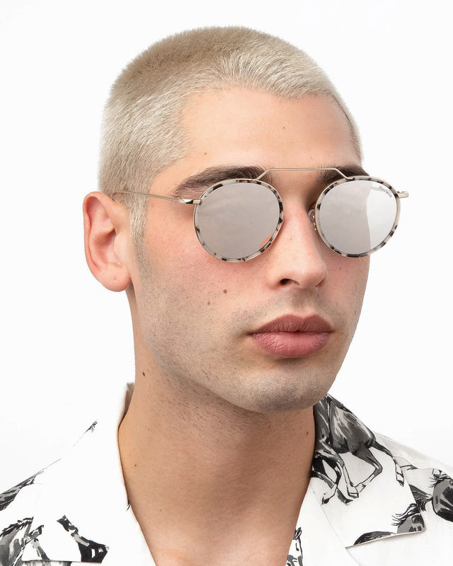 Model with blonde buzzcut wearing Wynwood Ace Sunglasses White Tortoise/Gold with Silver Flat Mirror